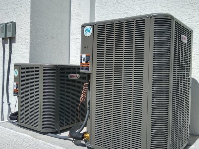 Both condensers leveled and strapped for weather. High quality installation.