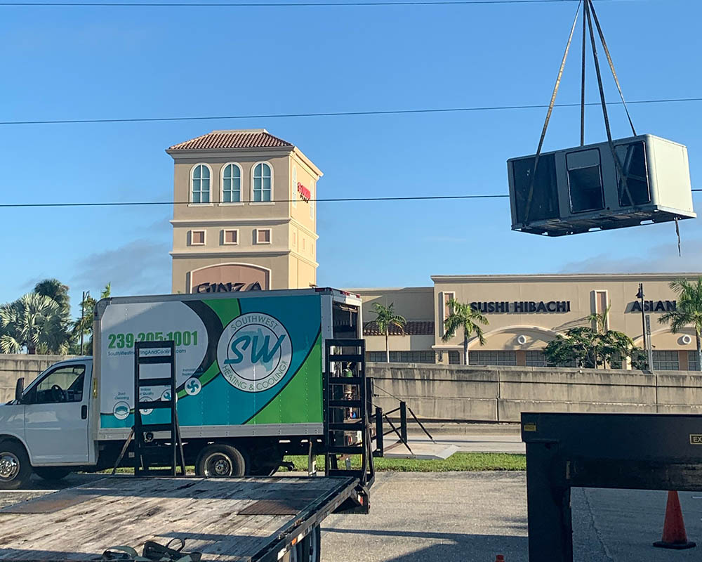 commercial hvac unit installed with a crane